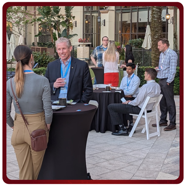 Apptio RegoU Recap25 Participants socializing and enjoying food and drinks at the reception